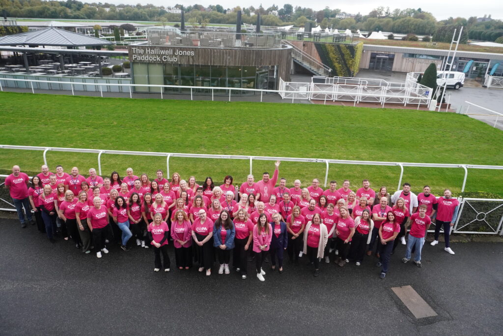 The COPA team wearing pink at the 2026 Summit